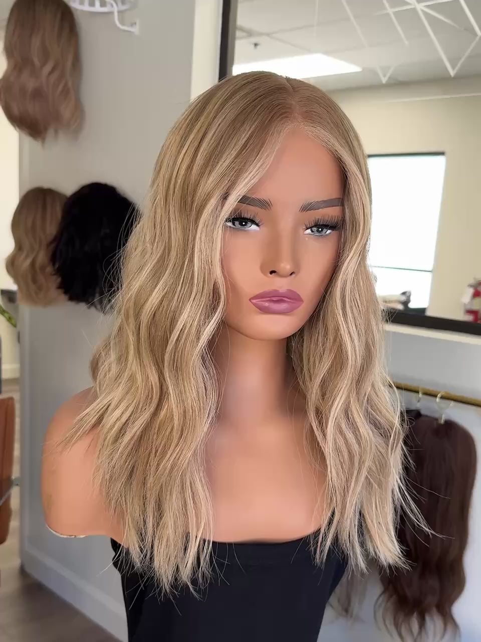 slightly rooted blonde wig, video showing hair movement. 